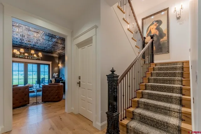 a spacious bathroom with a tub sink and mirror