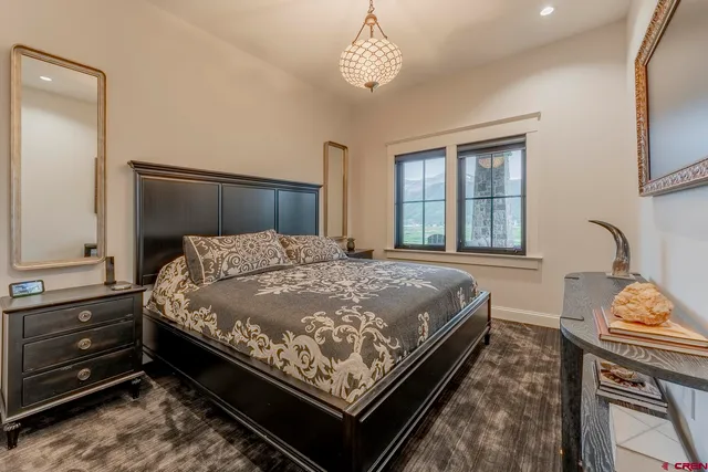 a kitchen with granite countertop kitchen island stainless steel appliances a sink and a stove