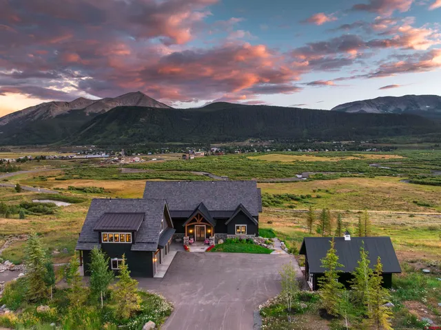 a living room with fireplace furniture and a flat screen tv