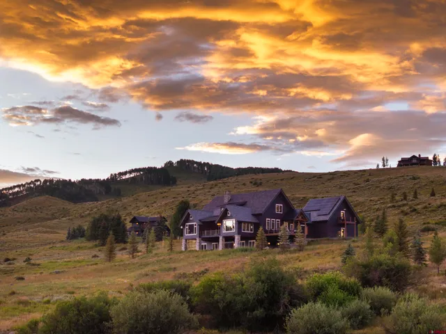 a kitchen with a table and chairs in it
