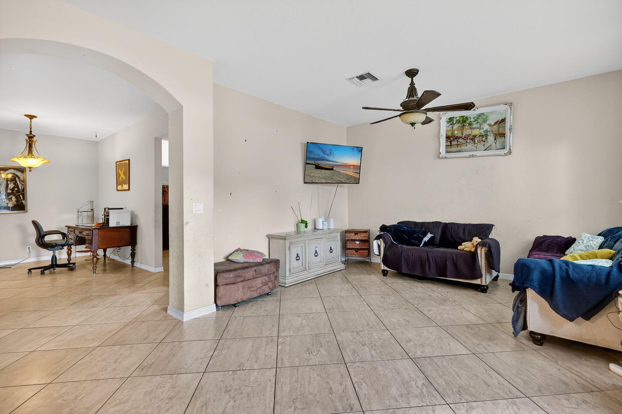 6720 Osage Circle Greenacres, FL 33413 - Photo 11 of 54 a living room with furniture and a flat screen tv