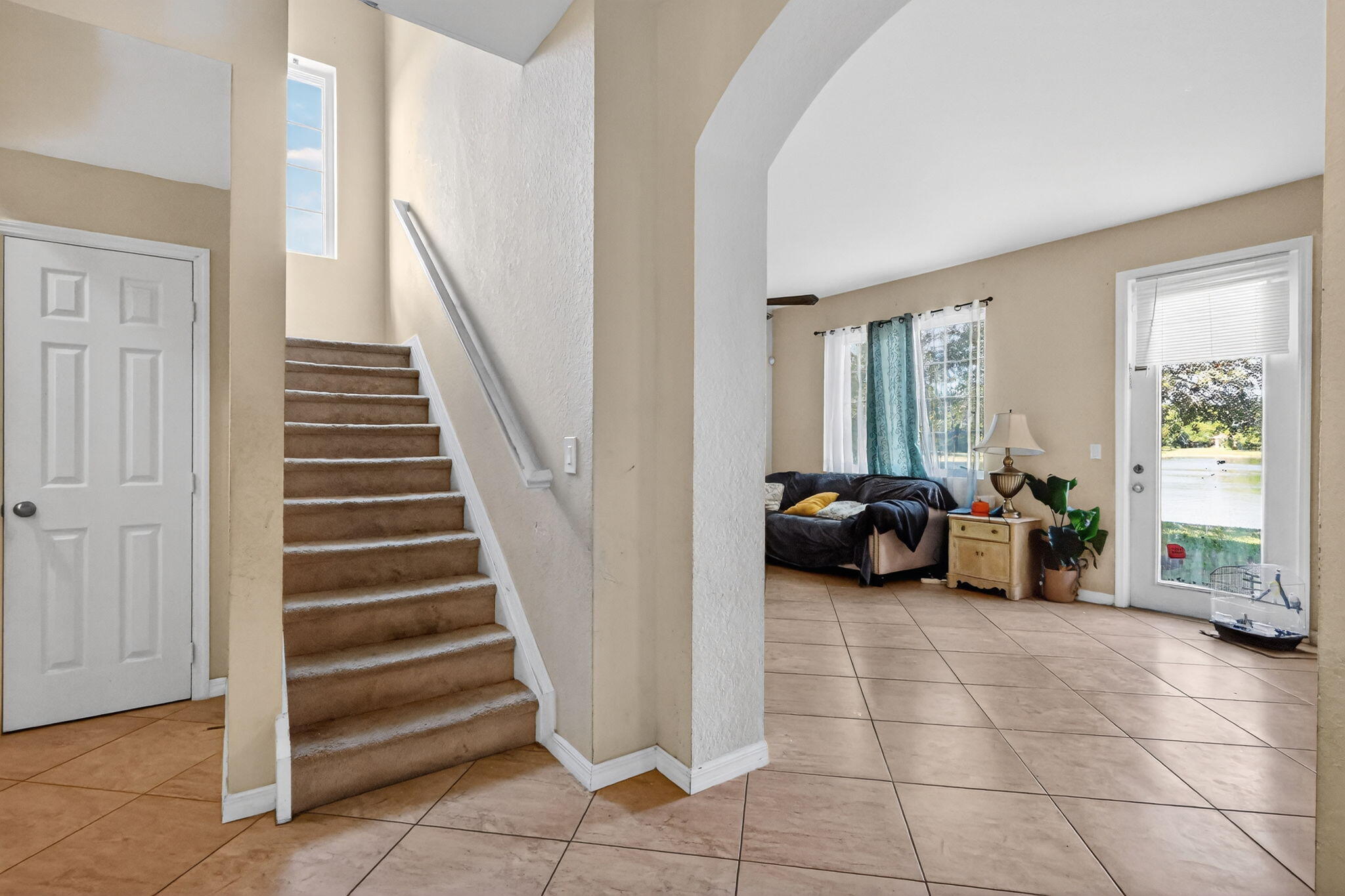 6720 Osage Circle Greenacres, FL 33413 - Photo 21 of 54 a view of a livingroom with furniture and staircase