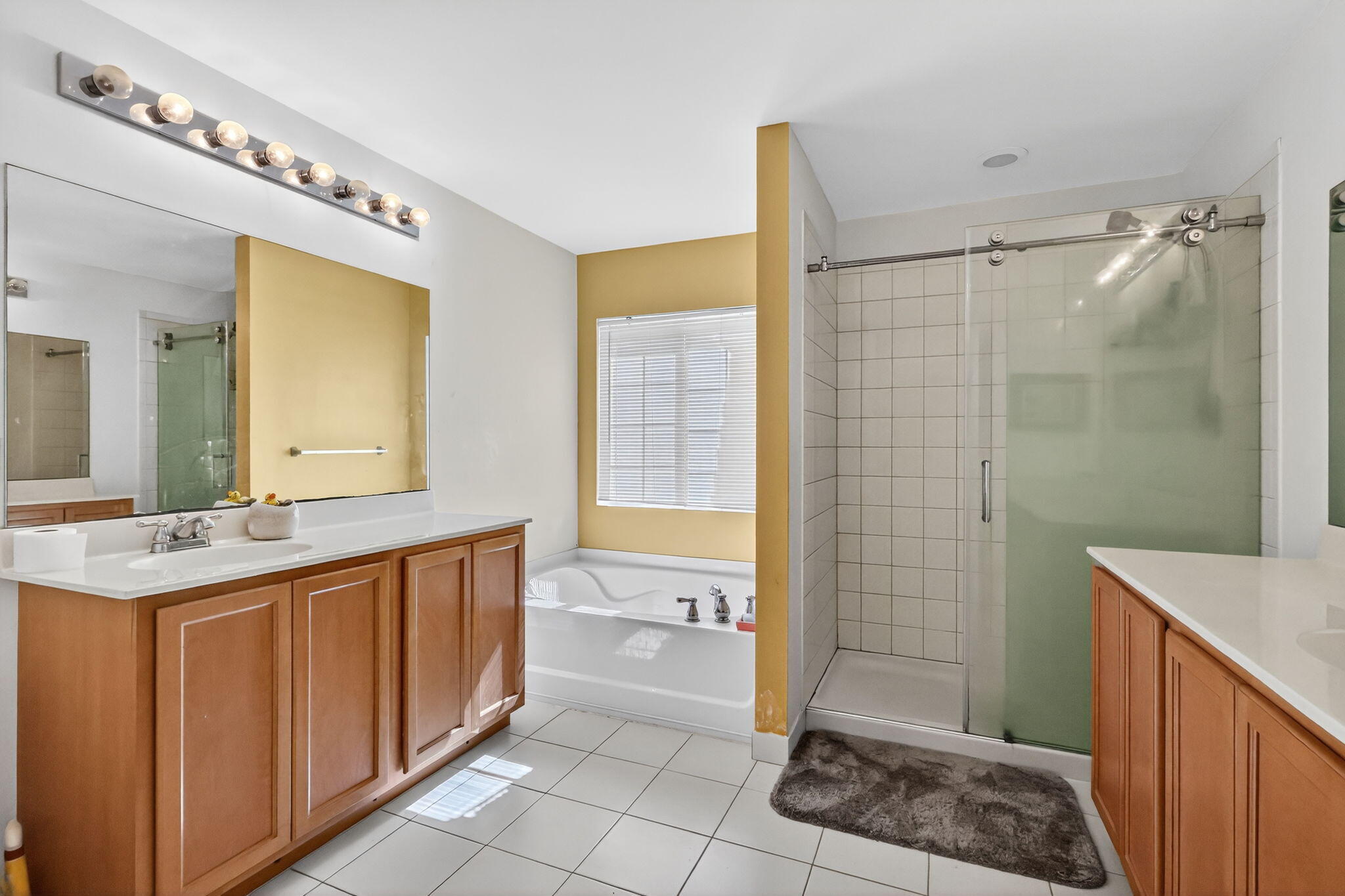 6720 Osage Circle Greenacres, FL 33413 - Photo 23 of 54 a bathroom with a granite countertop sink a toilet and shower