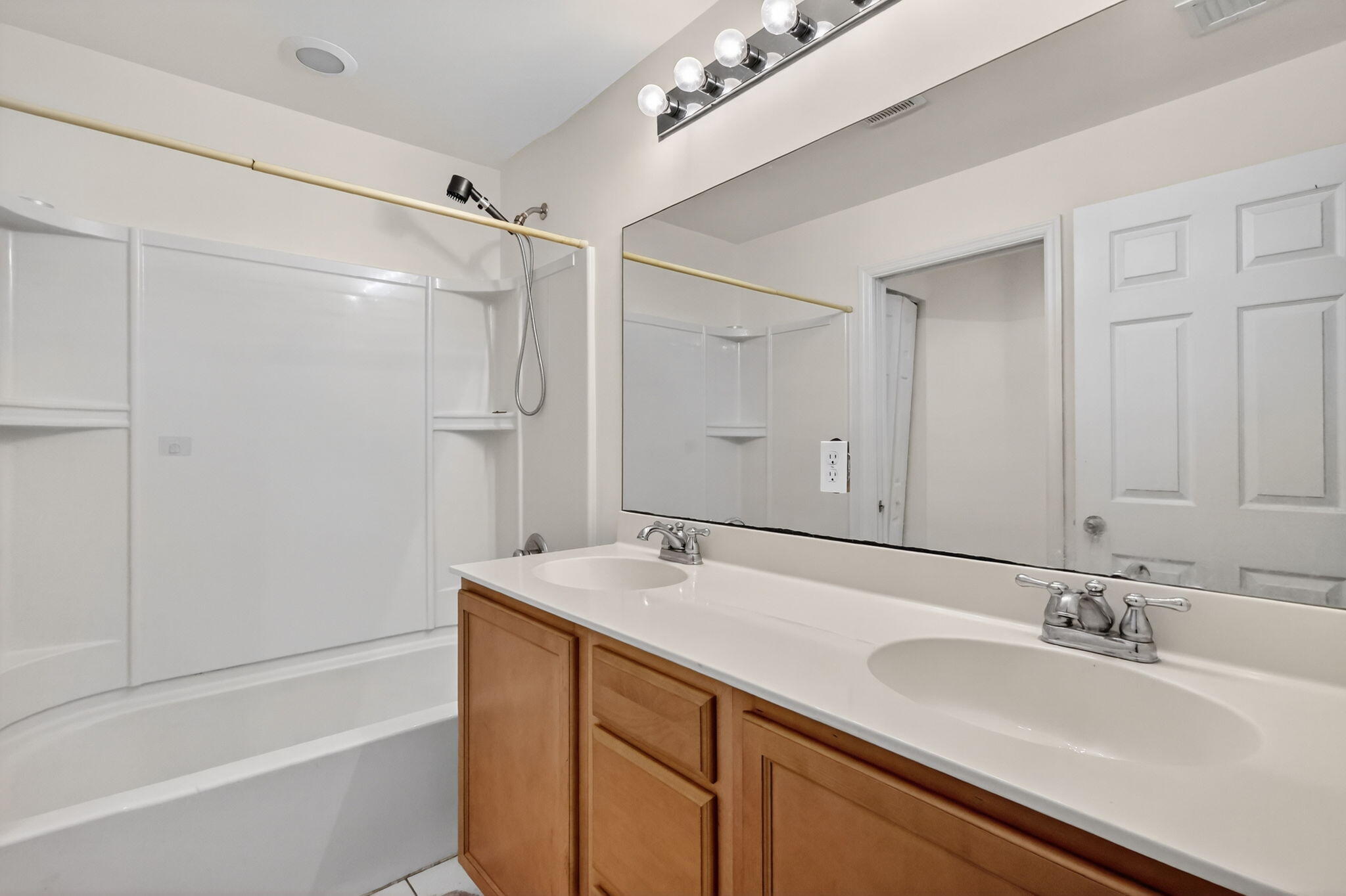 6720 Osage Circle Greenacres, FL 33413 - Photo 28 of 54 a bathroom with a tub sink and mirror