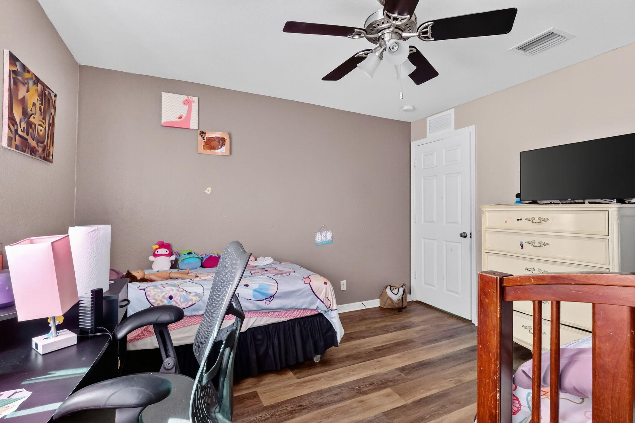 6720 Osage Circle Greenacres, FL 33413 - Photo 31 of 54 a view of a workspace with furniture and a flat screen tv