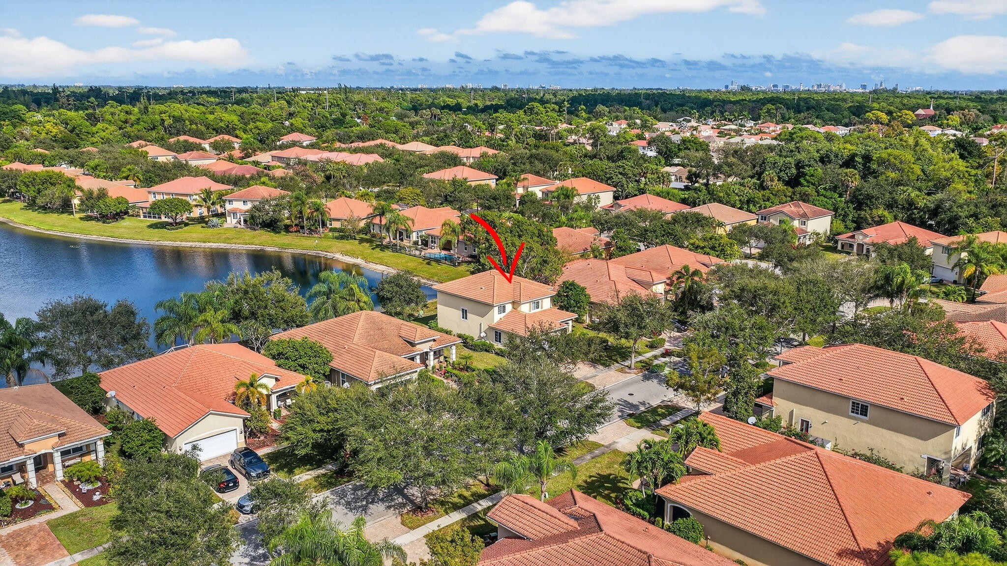 6720 Osage Circle Greenacres, FL 33413 - Photo 41 of 54 an aerial view of residential houses with outdoor space and lake view