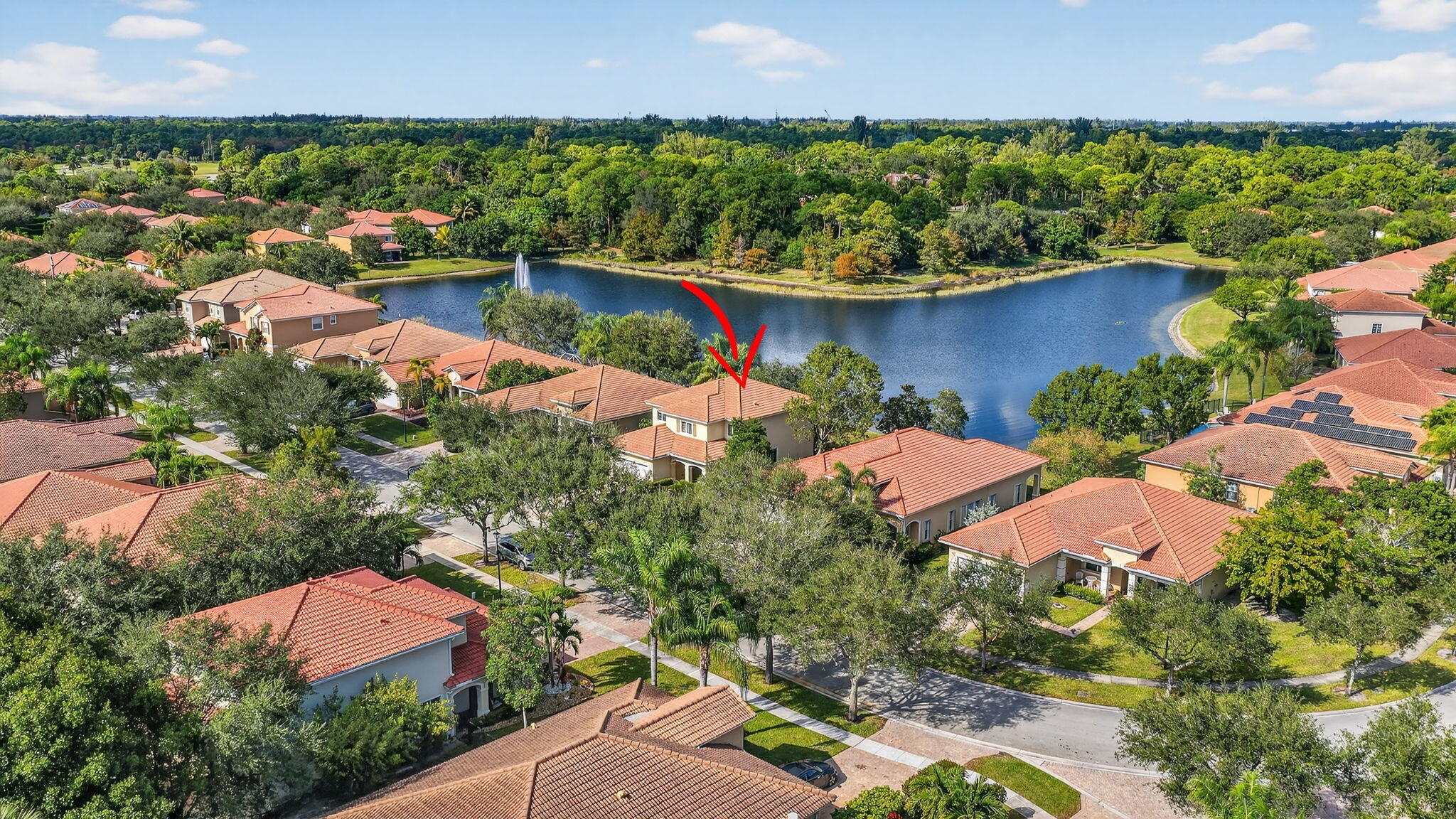 6720 Osage Circle Greenacres, FL 33413 - Photo 42 of 54 an aerial view of lake and houses with outdoor space