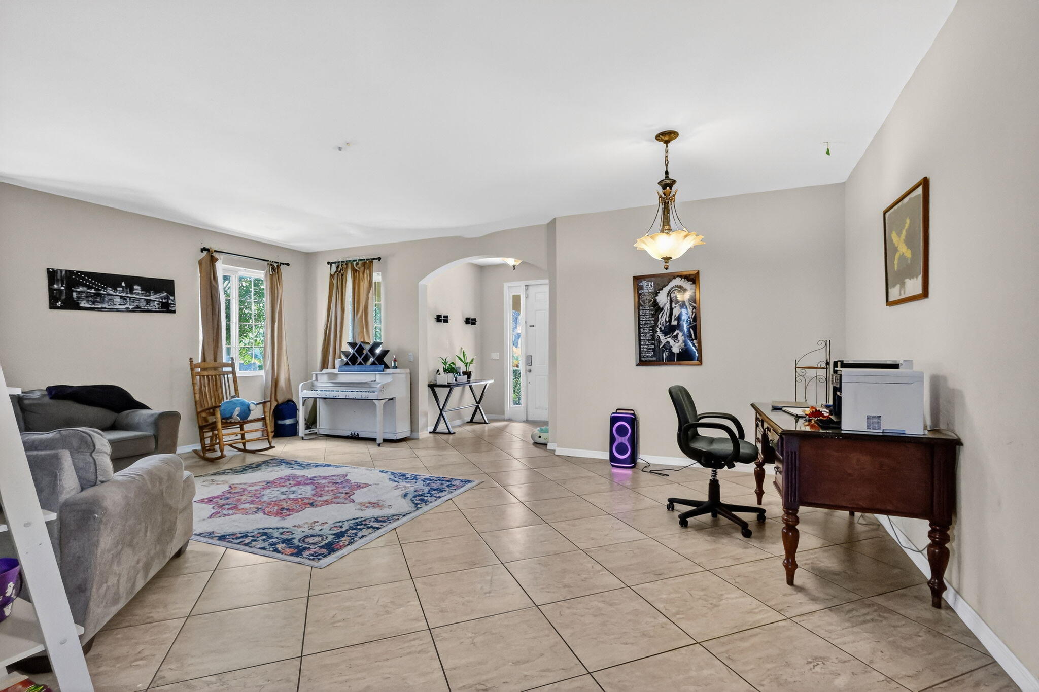 6720 Osage Circle Greenacres, FL 33413 - Photo 6 of 54 a living room with furniture a dining table and a piano