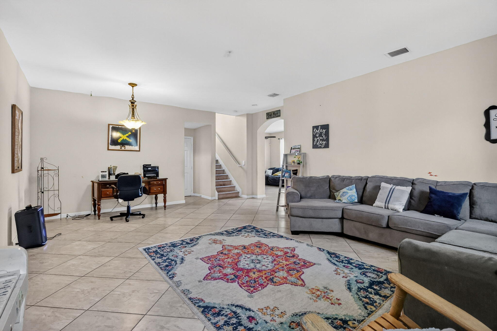 6720 Osage Circle Greenacres, FL 33413 - Photo 10 of 54 a living room with furniture and a dining table