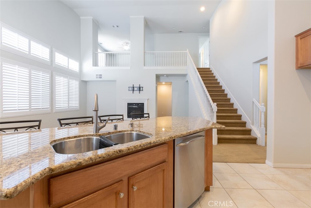 41640 Merryvale Lane Palmdale, CA 93551 - Photo 11 of 40 a kitchen with granite countertop a sink and cabinets