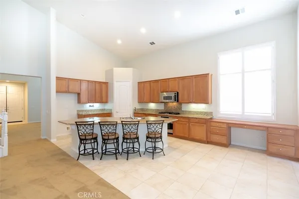 a kitchen with a table and chairs in it