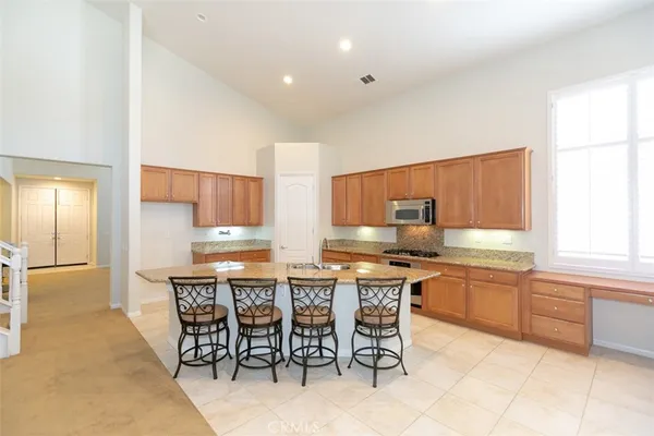 a view of kitchen with furniture and window