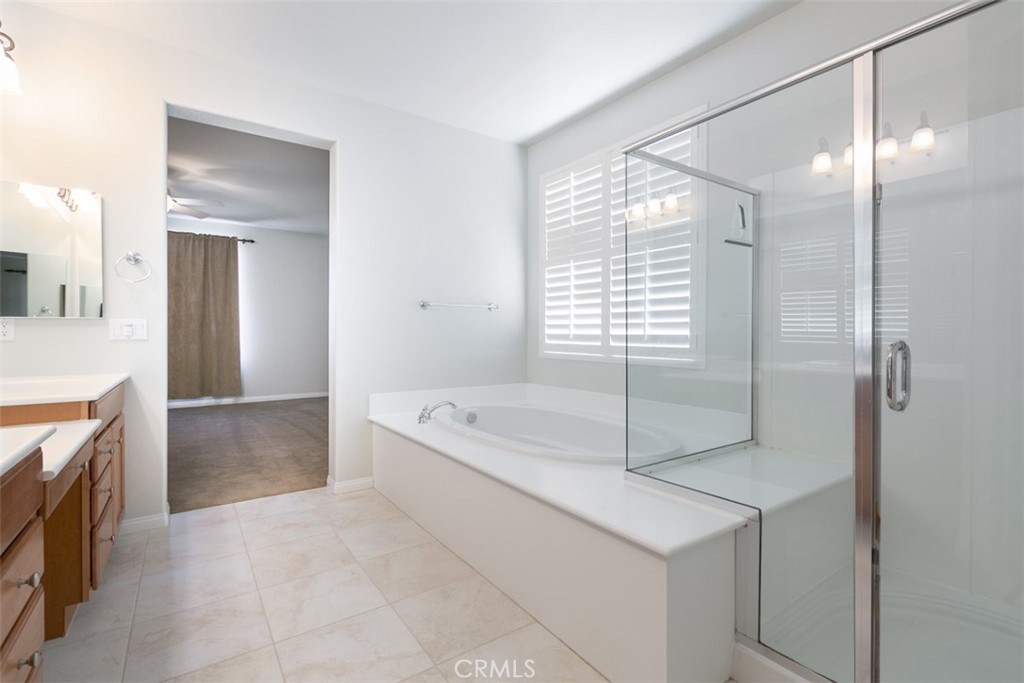 41640 Merryvale Lane Palmdale, CA 93551 - Photo 21 of 40 a spacious bathroom with a tub shower and sink