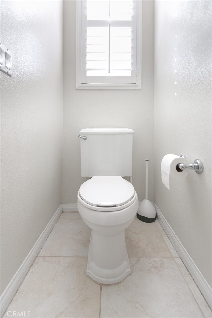 41640 Merryvale Lane Palmdale, CA 93551 - Photo 24 of 40 a white toilet sitting next to a window
