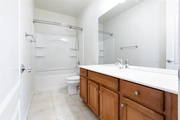 a bathroom with a toilet a sink and bathtub