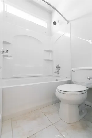 a bathroom with a double vanity sink a mirror and a shower