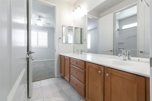 a bathroom with a sink toilet and mirror