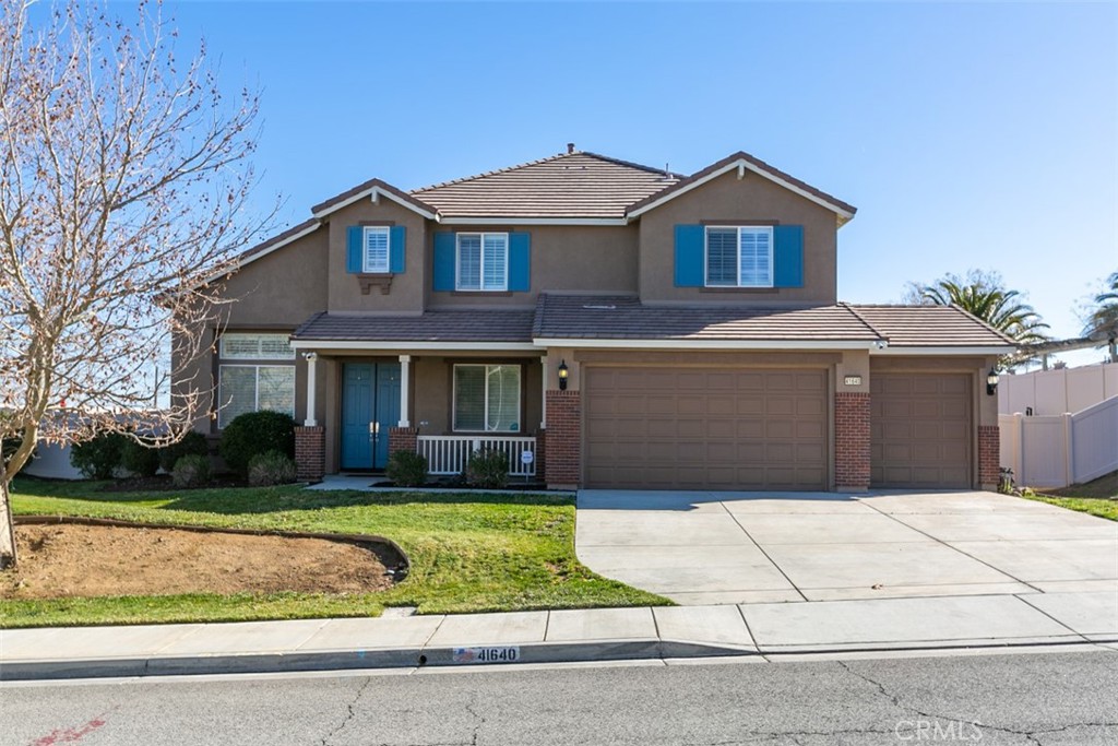 41640 Merryvale Lane Palmdale, CA 93551 - Photo 40 of 40 a front view of a house with a yard and garage