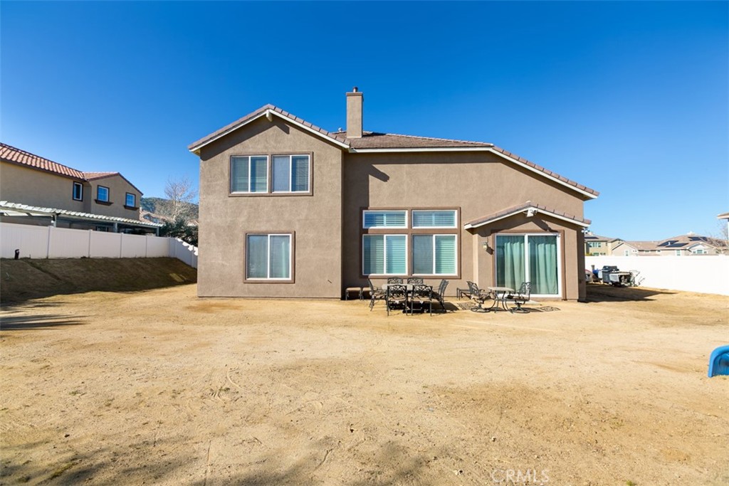 41640 Merryvale Lane Palmdale, CA 93551 - Photo 6 of 40 a view of a house with a yard and parking space