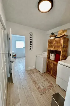 a bedroom with a bed and a sink