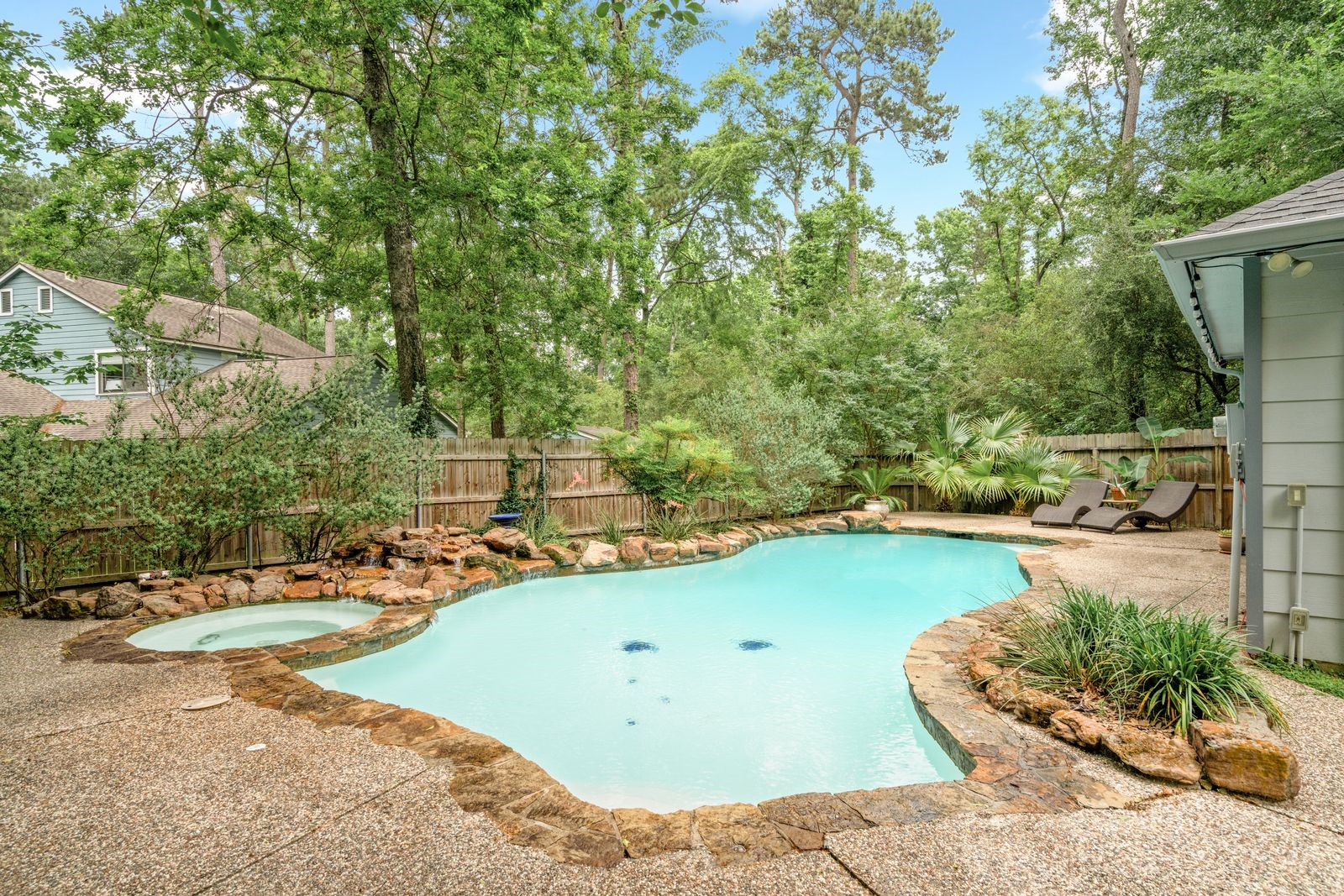 77 South Placid Hill Circle Spring, TX 77381 - Photo 2 of 48 Private backyard oasis featuring a sparkling pool, mature trees, lush landscaping, and exceptional privacy.