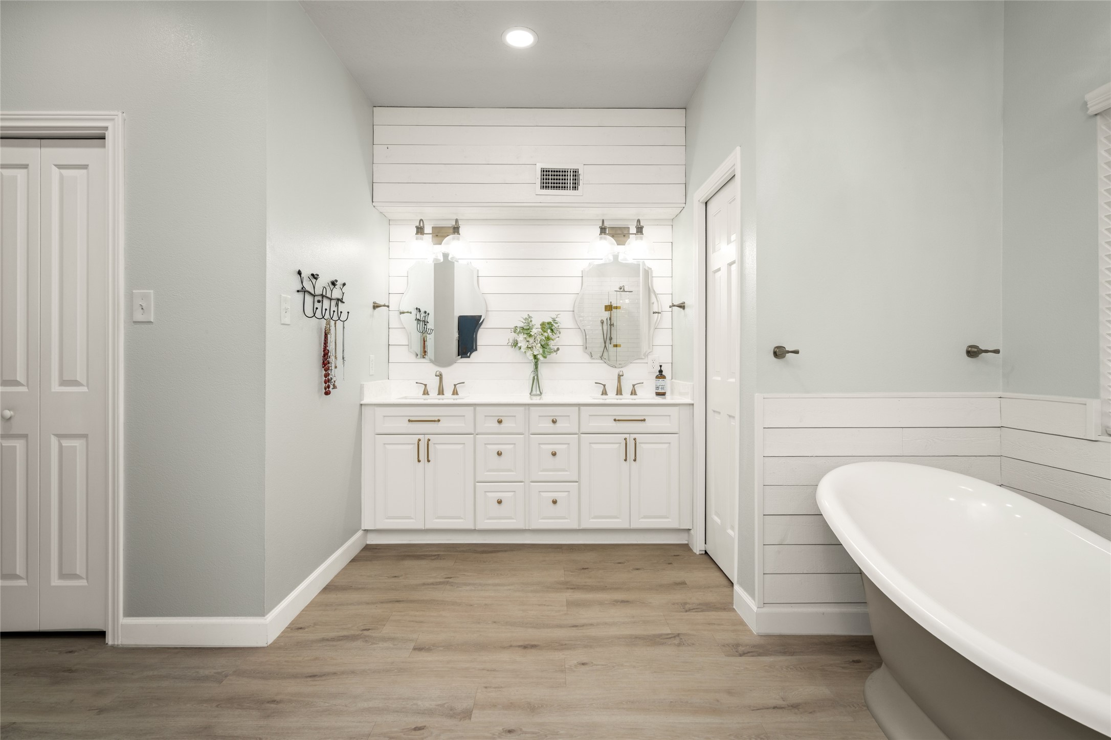 77 South Placid Hill Circle Spring, TX 77381 - Photo 23 of 48 All new vanity with dual sinks, designer finishes, custom details, and shiplap accent walls.