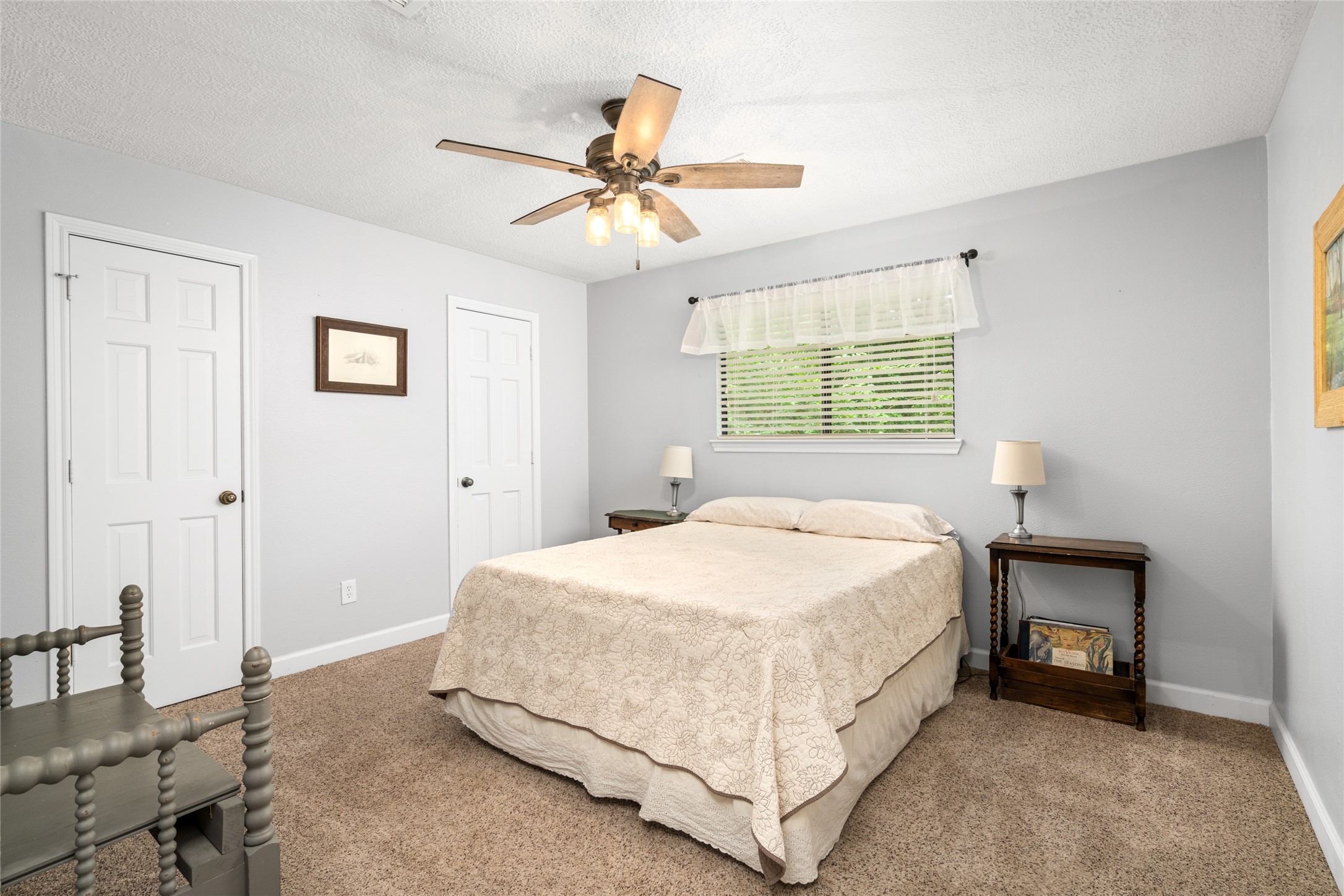 77 South Placid Hill Circle Spring, TX 77381 - Photo 27 of 48 Spacious 3rd bedroom upstairs with dual closets, ceiling fan, and a view of the backyard.
