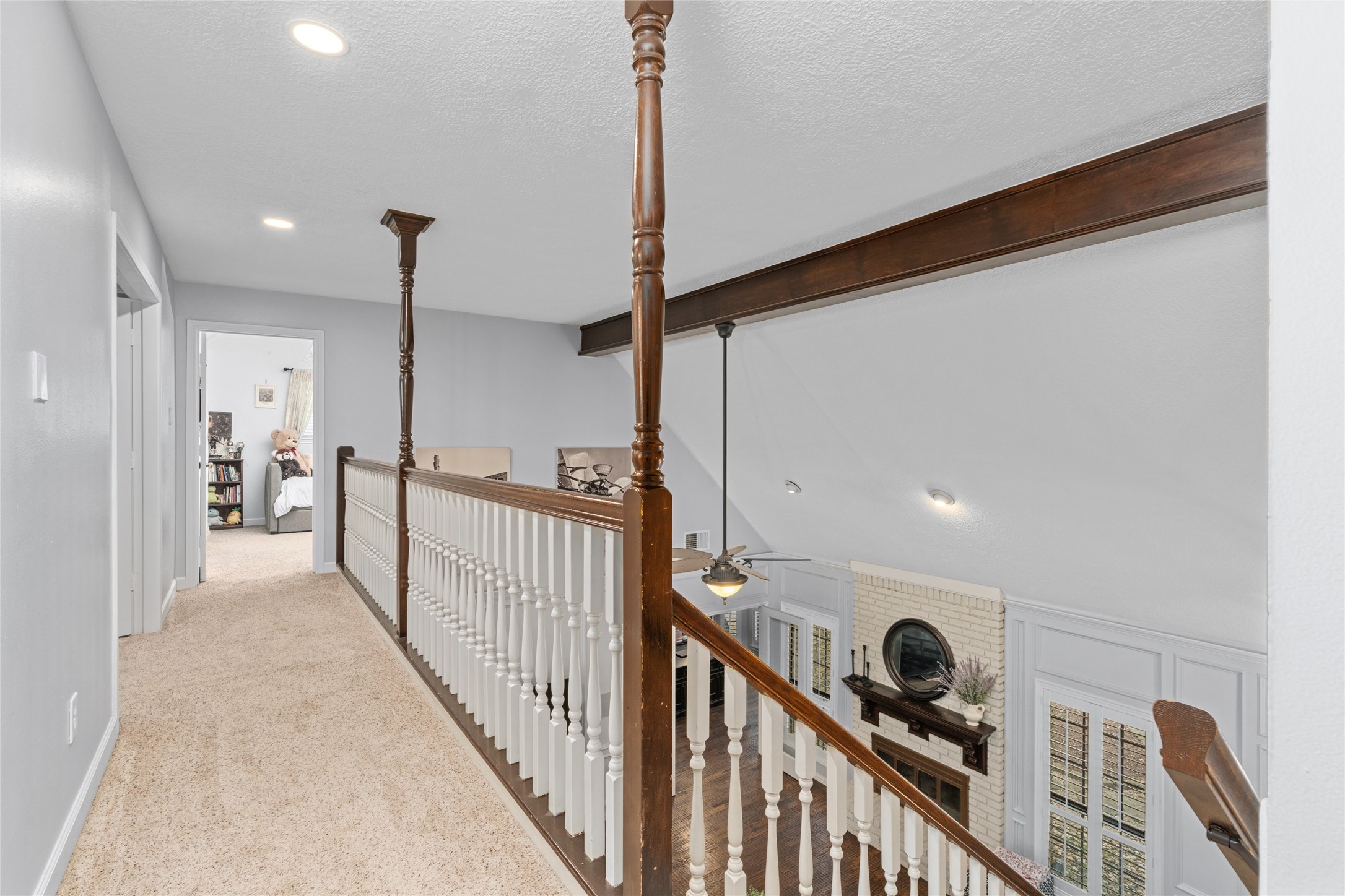 77 South Placid Hill Circle Spring, TX 77381 - Photo 33 of 48 The upper level is open to the living room below.