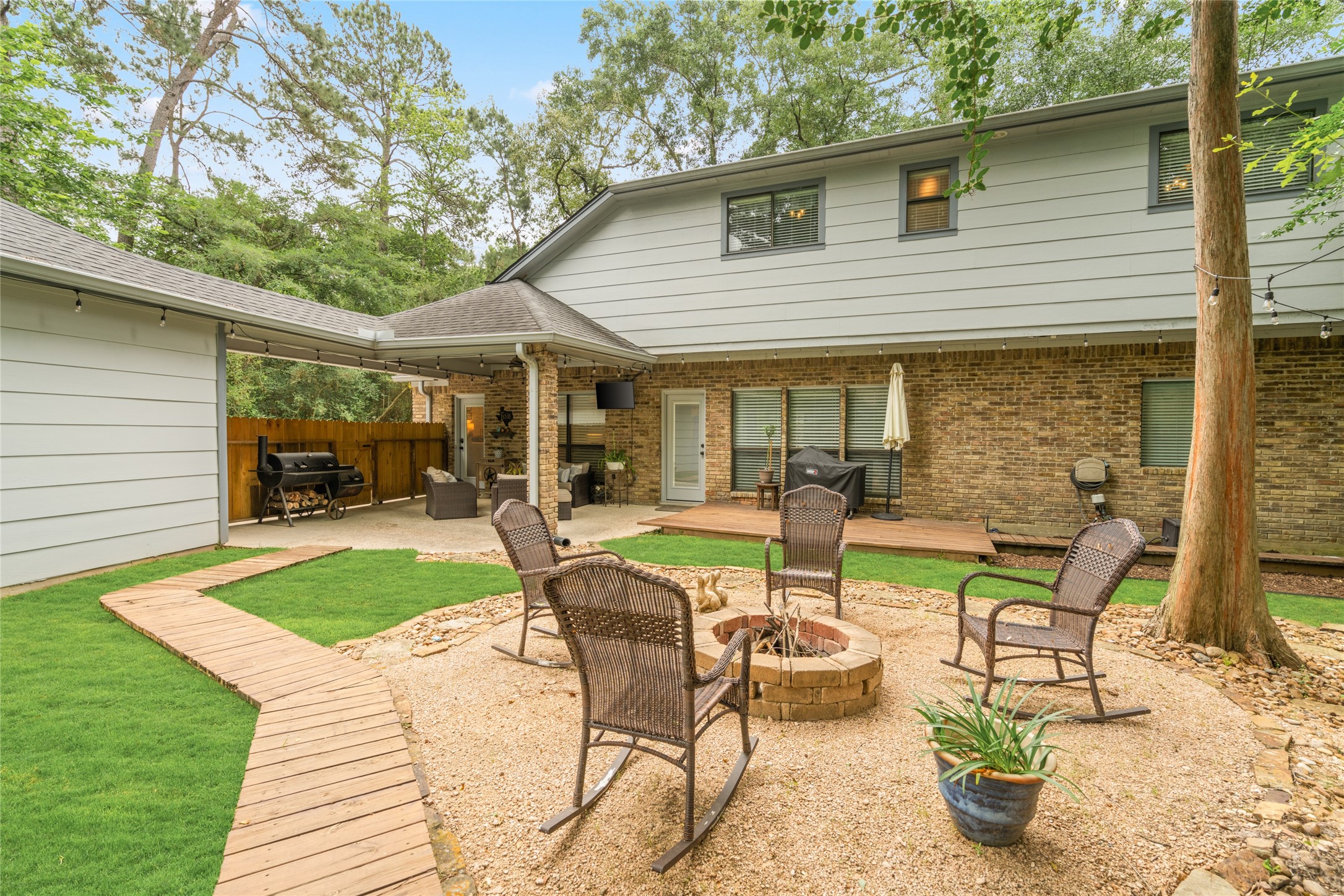 77 South Placid Hill Circle Spring, TX 77381 - Photo 42 of 48 Enjoy multiple entertaining spaces with plenty of room to relax, unwind, and enjoy the peaceful wooded setting.