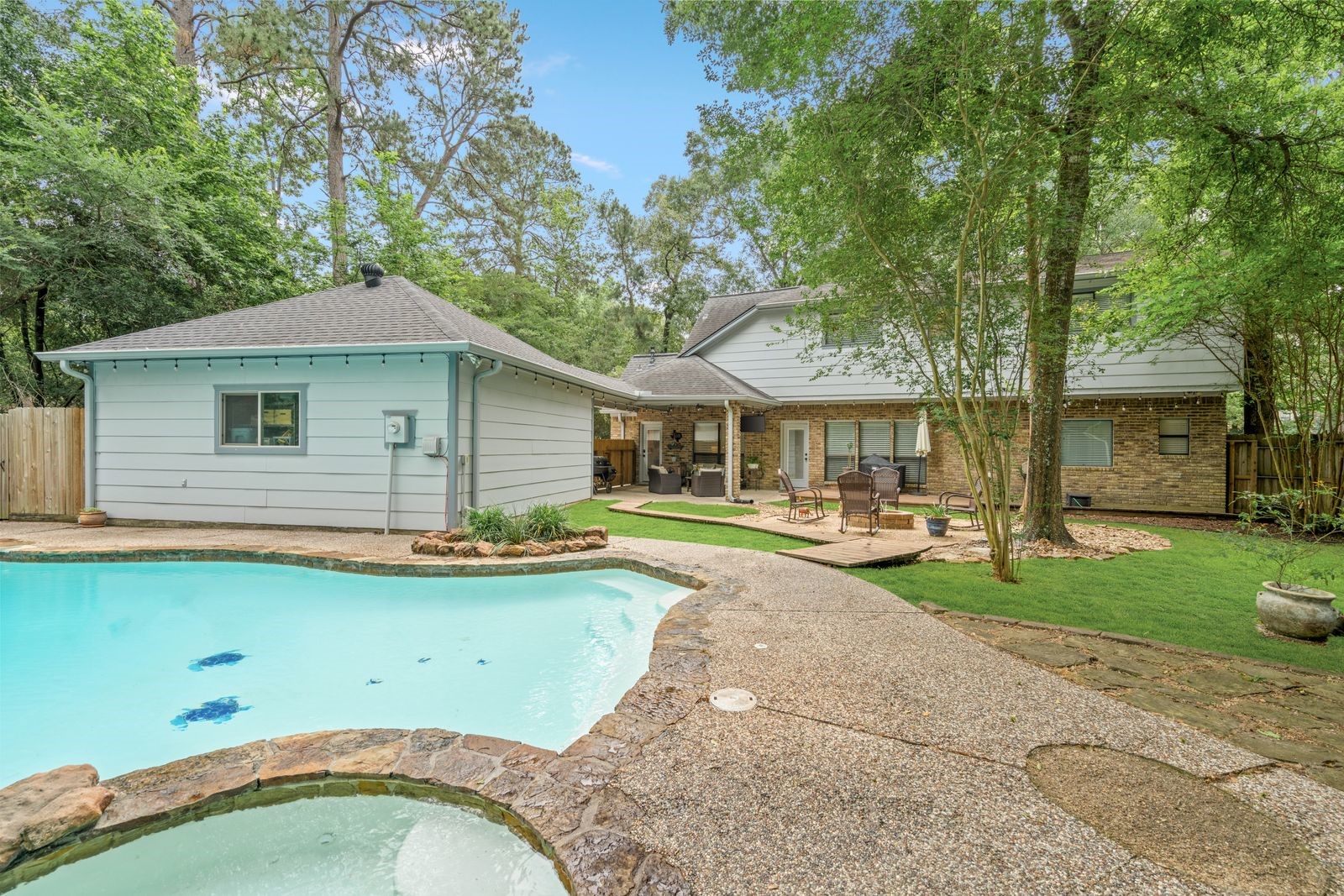 77 South Placid Hill Circle Spring, TX 77381 - Photo 46 of 48 Full open view of the backyard up to the home from the hot tub.
