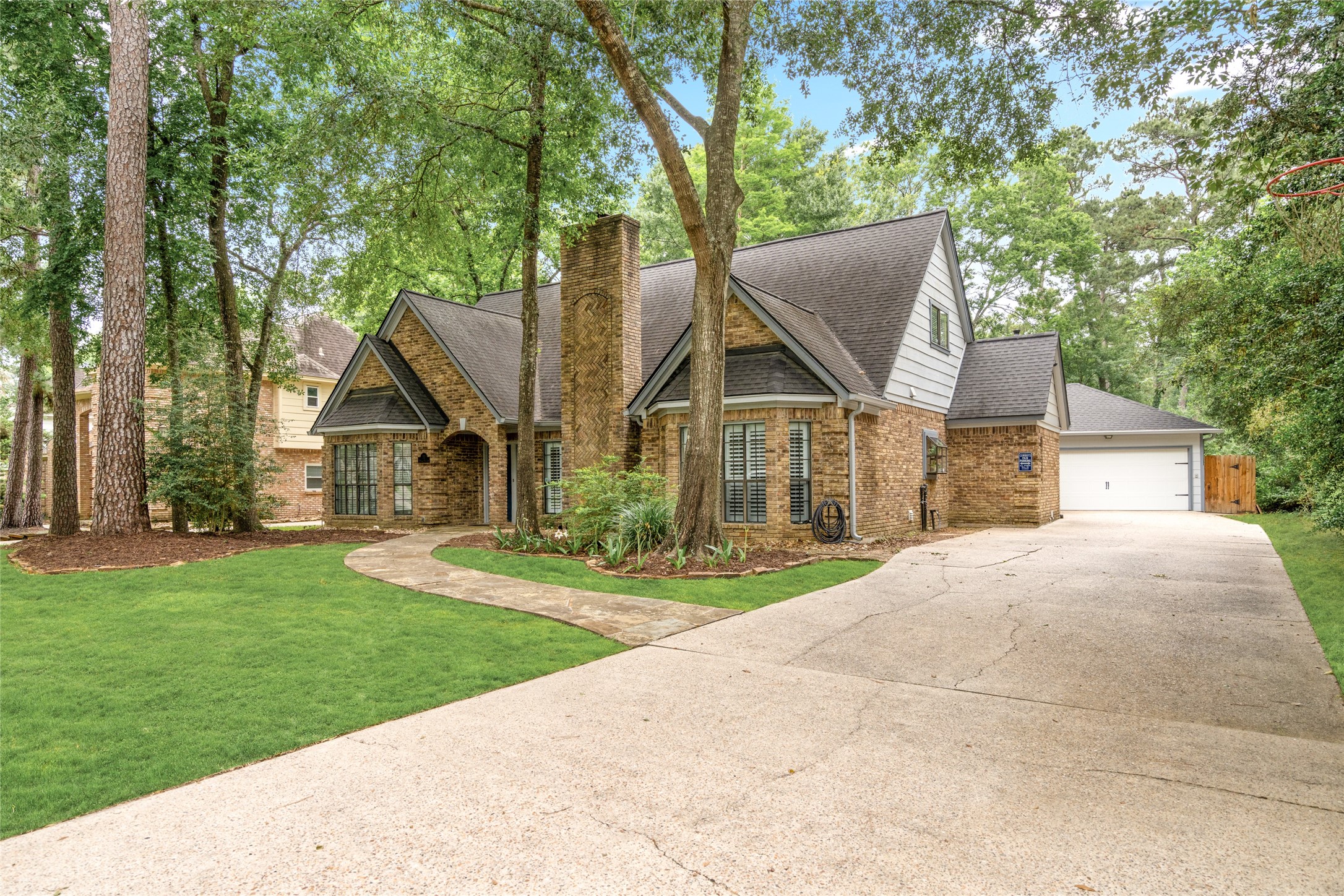 77 South Placid Hill Circle Spring, TX 77381 - Photo 47 of 48 Large extended double-wide driveway to the detached two-car garage. No direct neighbors on the right side of the home for extra privacy.