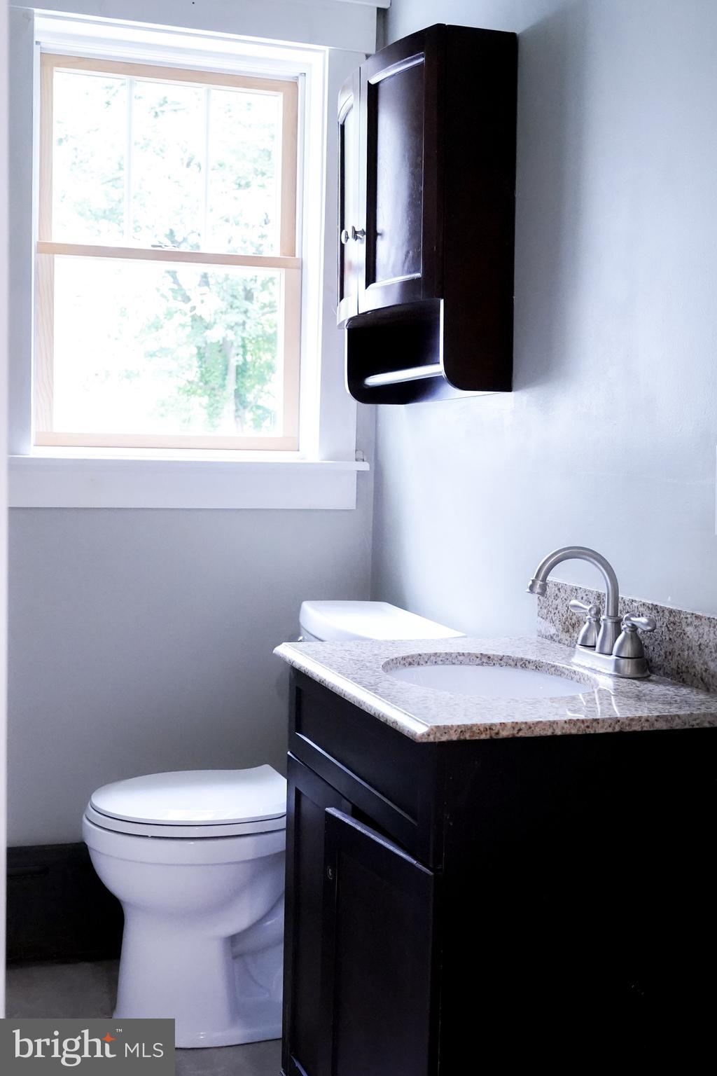 15 Beaver Avenue Mount Laurel, NJ 08054 - Photo 12 of 41 a bathroom with a granite countertop sink toilet and mirror