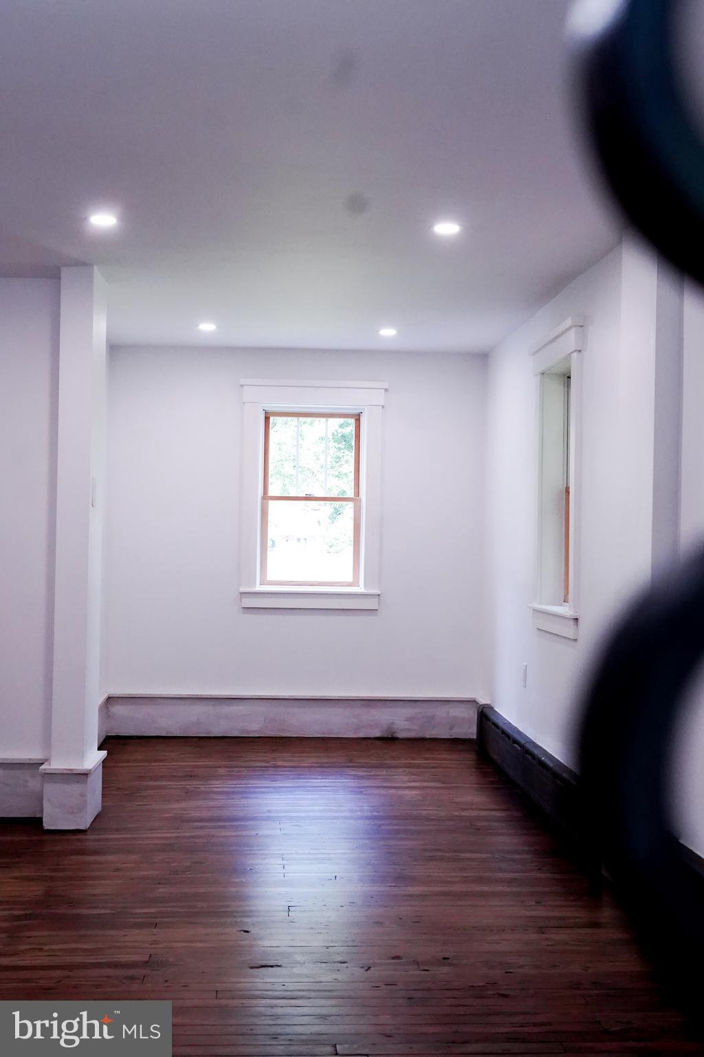 15 Beaver Avenue Mount Laurel, NJ 08054 - Photo 28 of 41 an empty room with wooden floor and windows