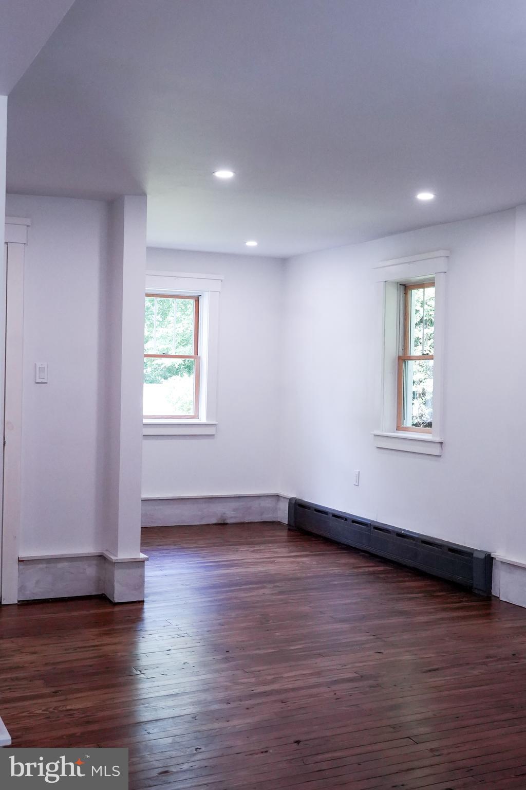 15 Beaver Avenue Mount Laurel, NJ 08054 - Photo 40 of 41 an empty room with wooden floor and windows