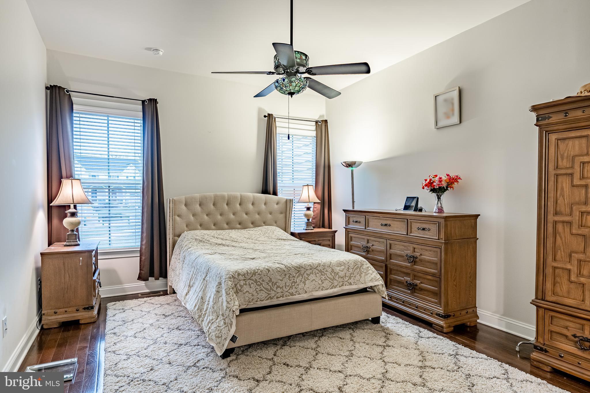 416 Patriots Path Malvern, PA 19355 - Photo 15 of 37 a bedroom with a bed and a chandelier