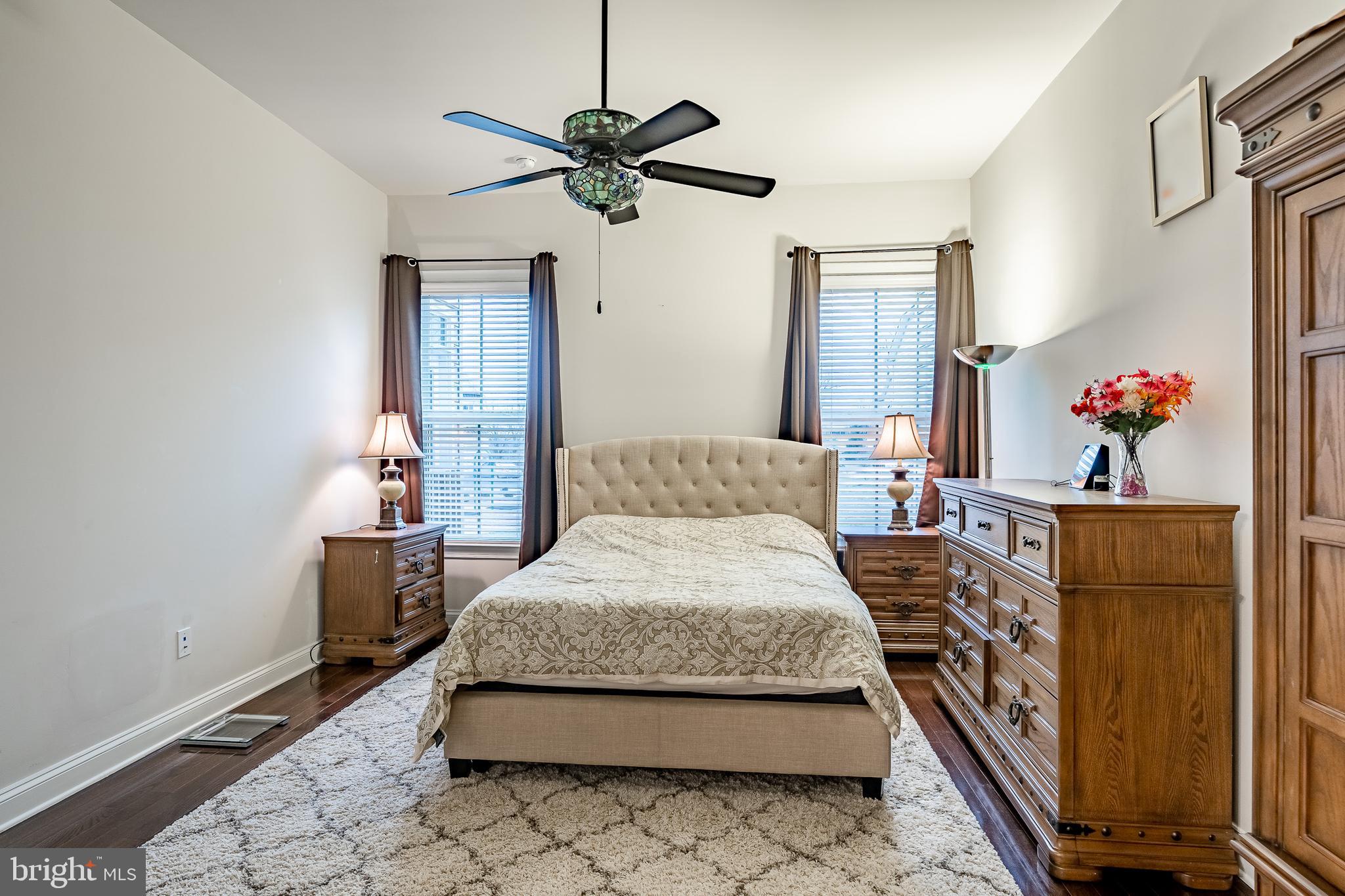 416 Patriots Path Malvern, PA 19355 - Photo 16 of 37 a bedroom with a bed and a chandelier