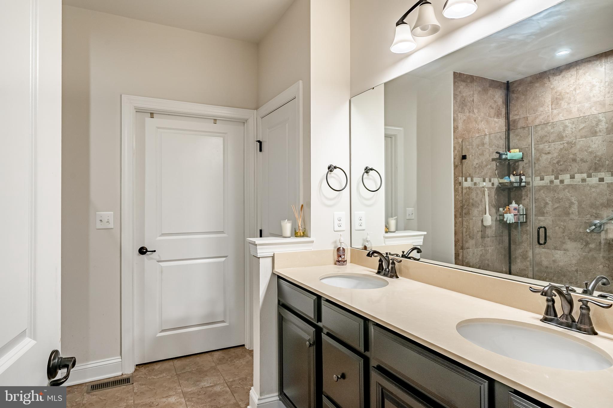 416 Patriots Path Malvern, PA 19355 - Photo 17 of 37 a bathroom with a sink double vanity and a mirror