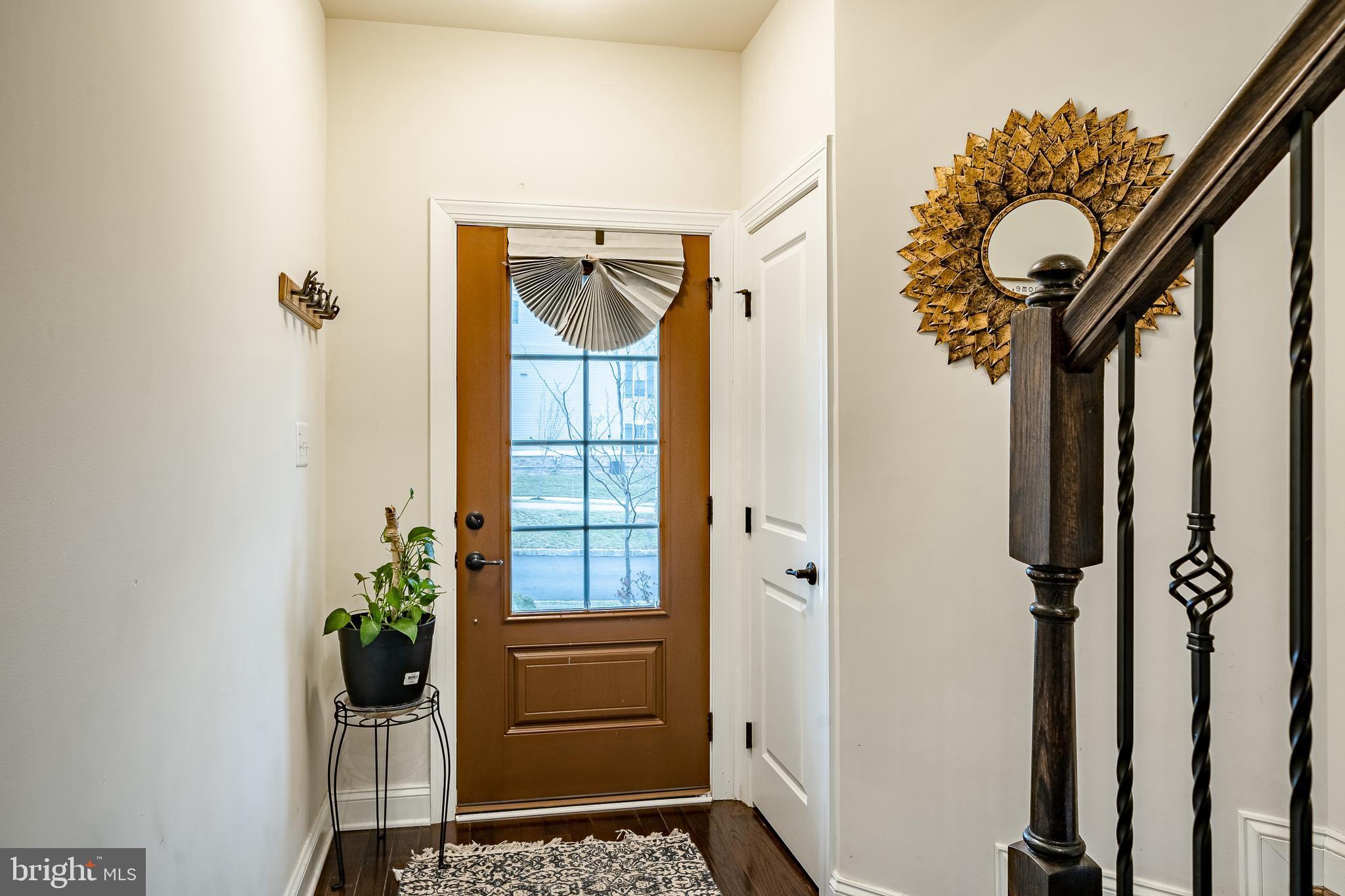 416 Patriots Path Malvern, PA 19355 - Photo 21 of 37 a view of a hallway with wooden floor and front door