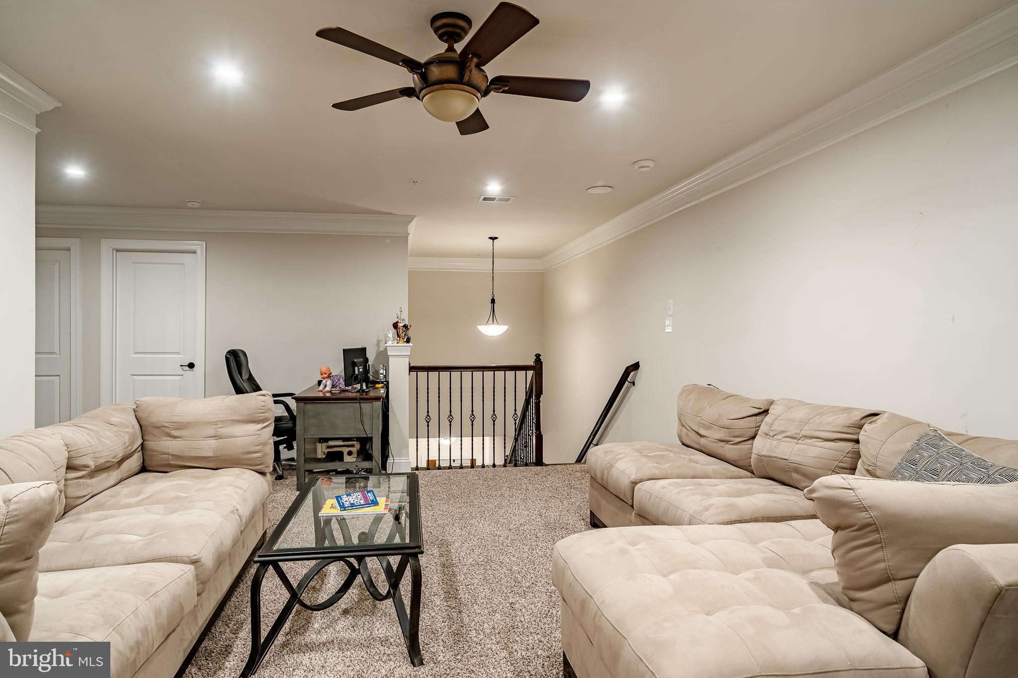416 Patriots Path Malvern, PA 19355 - Photo 25 of 37 a living room with furniture and a ceiling fan