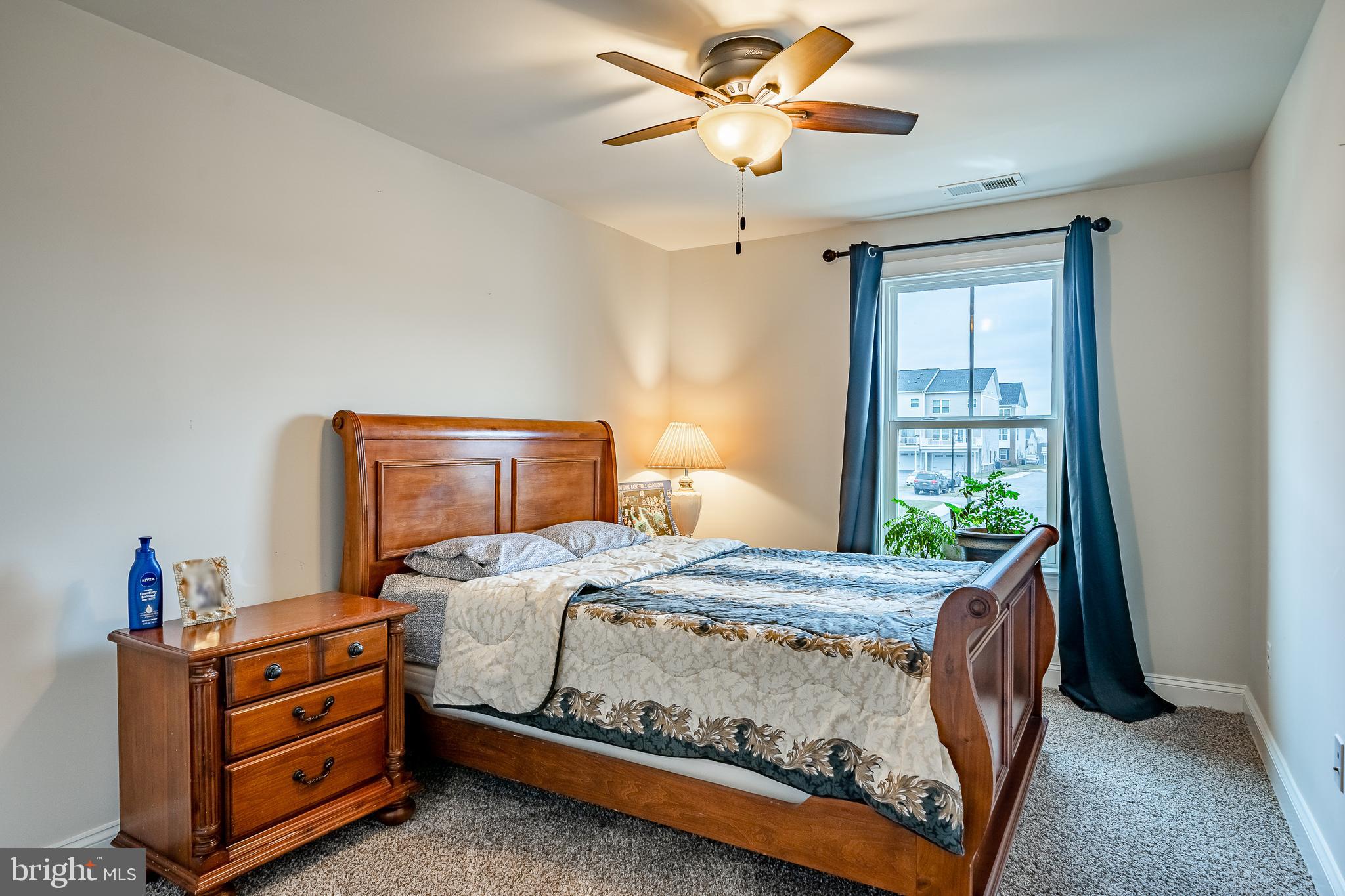 416 Patriots Path Malvern, PA 19355 - Photo 29 of 37 a bedroom with a bed and a chandelier