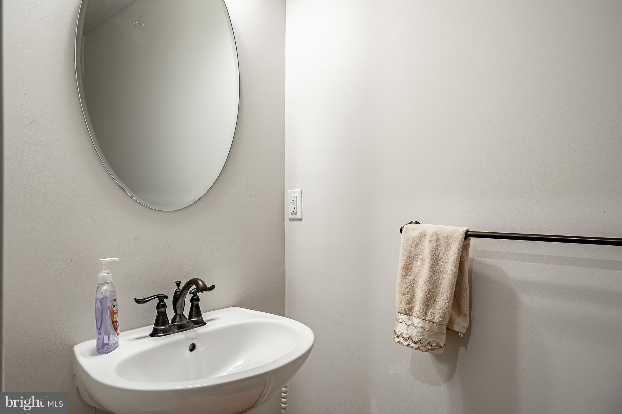 416 Patriots Path Malvern, PA 19355 - Photo 31 of 37 a bathroom with a sink and a mirror