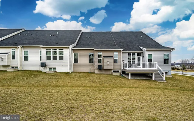 a swimming pool view with a outdoor seating