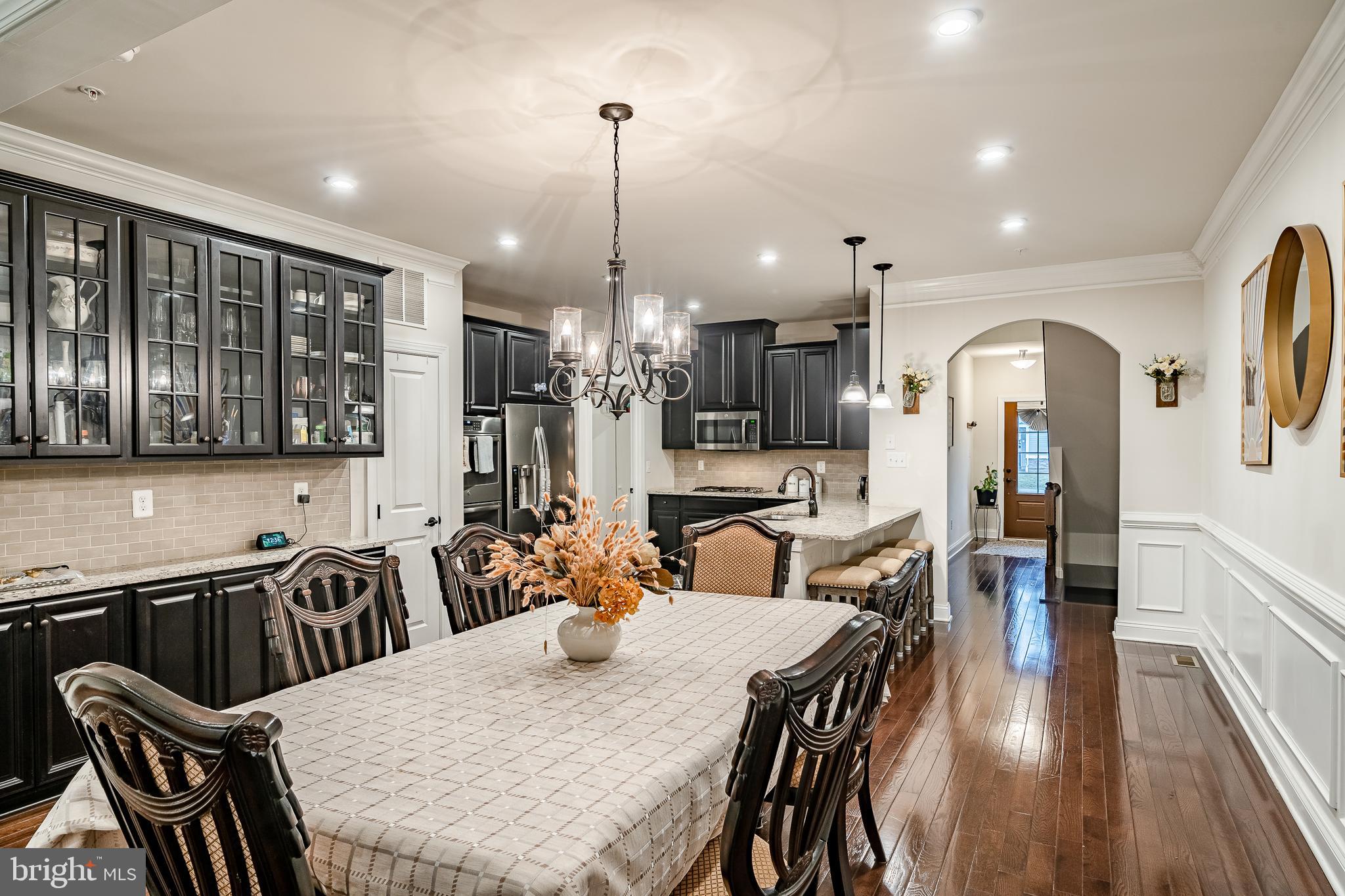 416 Patriots Path Malvern, PA 19355 - Photo 8 of 37 a view of a a dining room with furniture window and wooden floor