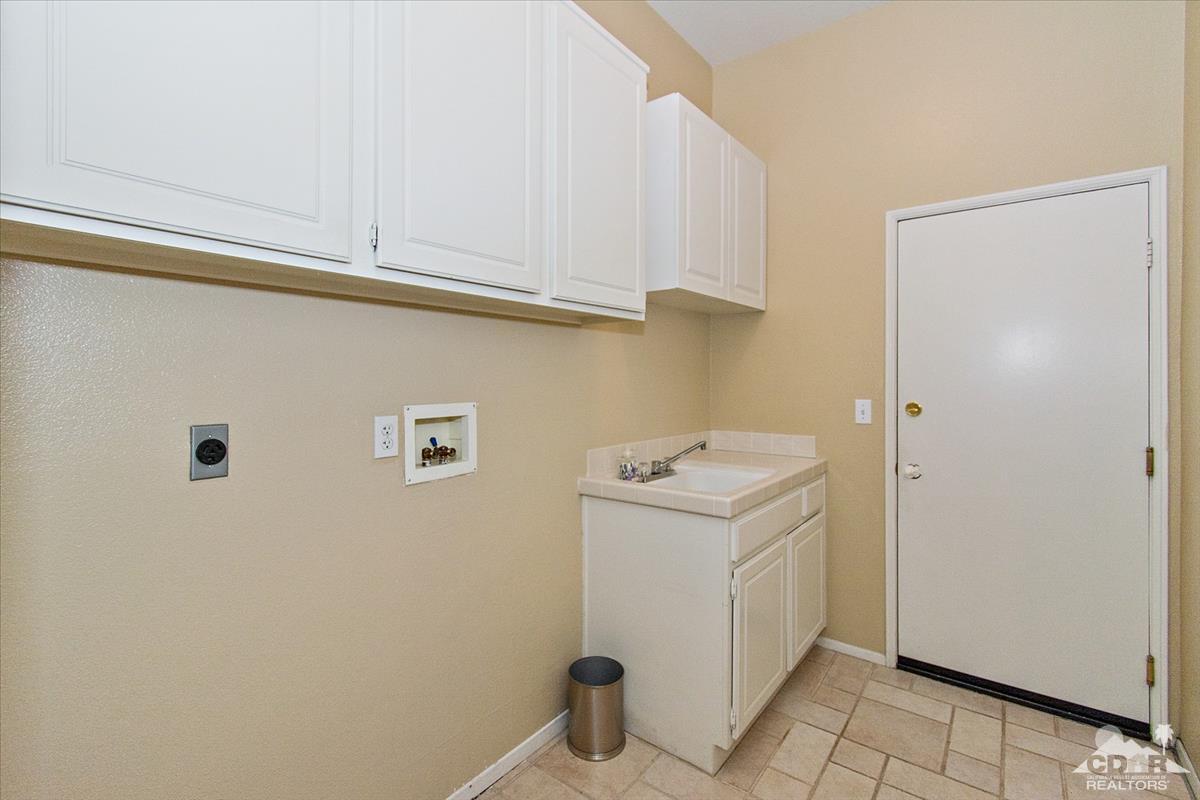 38 Santa Ynez Rancho Mirage, CA 92270 - Photo 18 of 38 a utility room with dryer and washer