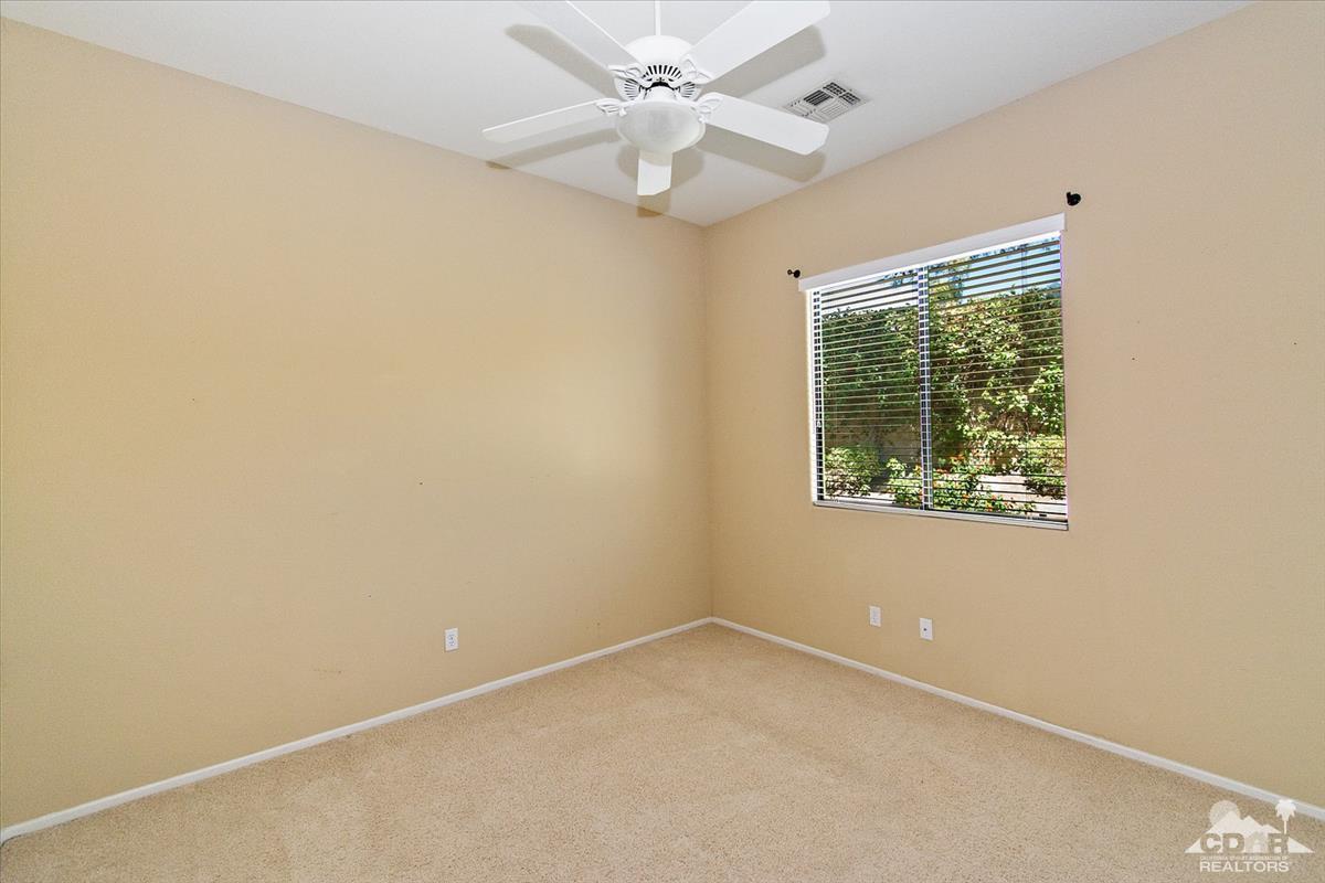 38 Santa Ynez Rancho Mirage, CA 92270 - Photo 19 of 38 an empty room with a window and a fan