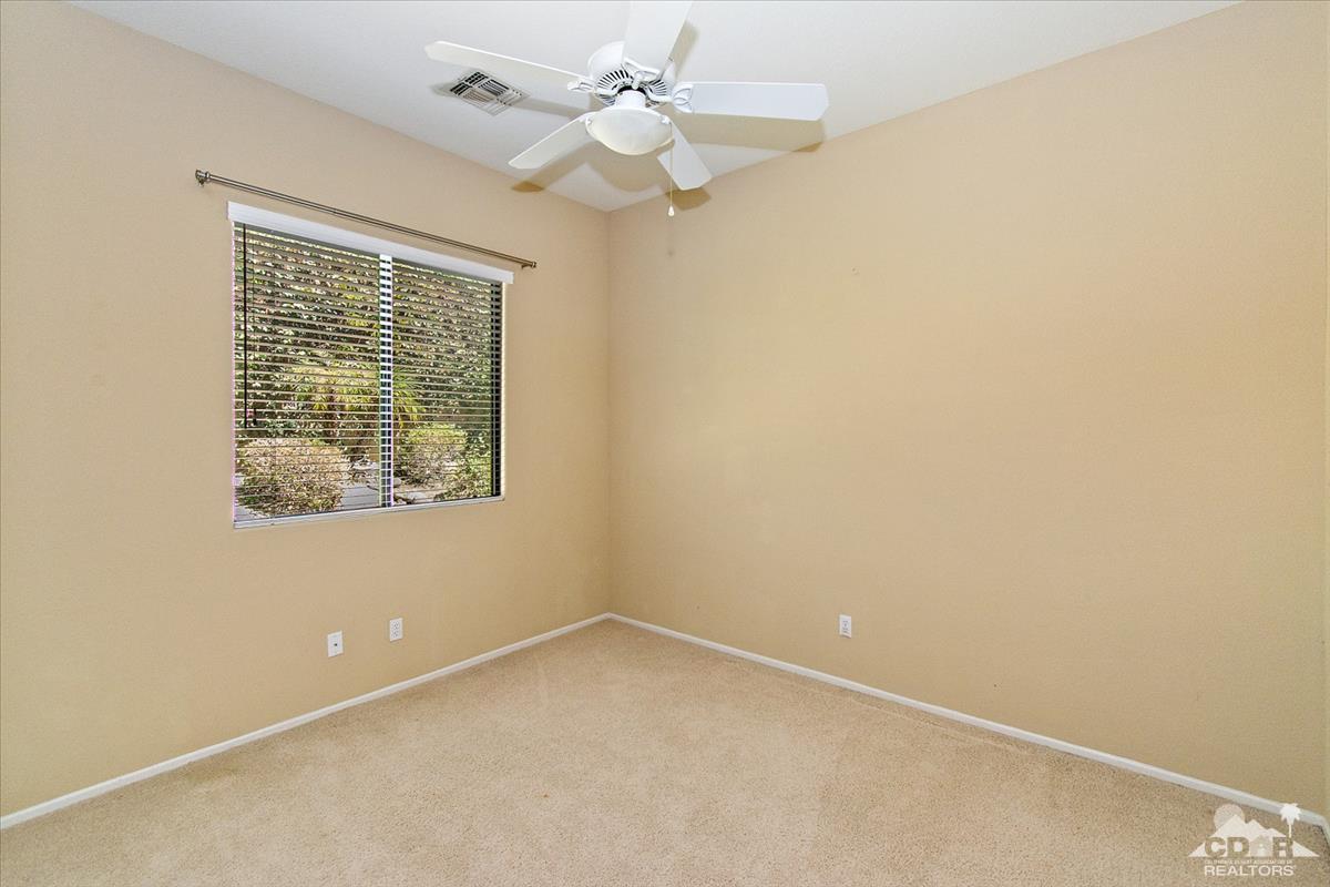 38 Santa Ynez Rancho Mirage, CA 92270 - Photo 20 of 38 an empty room with a window and a fan
