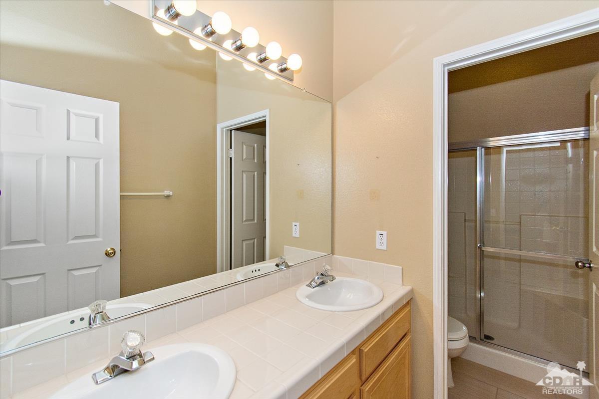 38 Santa Ynez Rancho Mirage, CA 92270 - Photo 21 of 38 a bathroom with a sink and a mirror