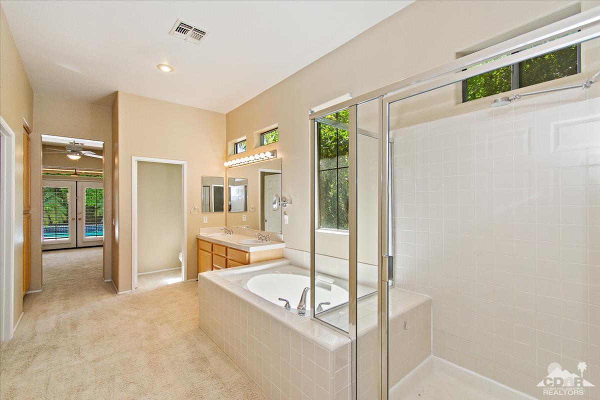 38 Santa Ynez Rancho Mirage, CA 92270 - Photo 27 of 38 a spacious bathroom with a tub and shower