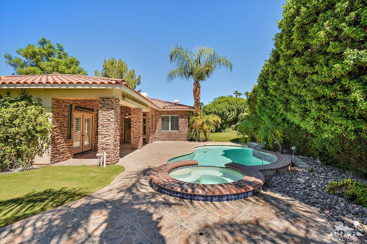 38 Santa Ynez Rancho Mirage, CA 92270 - Photo 29 of 38 a view of an house with backyard space and garden