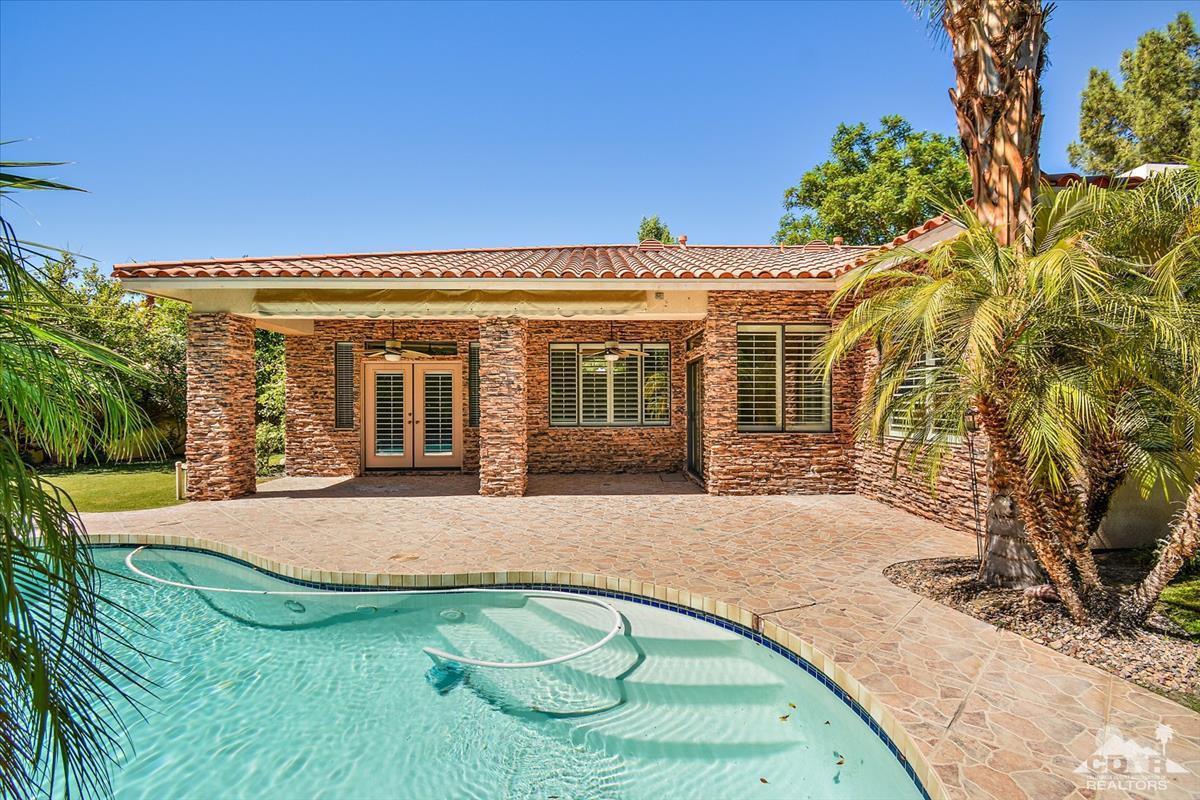 38 Santa Ynez Rancho Mirage, CA 92270 - Photo 32 of 38 front view of a house with a yard